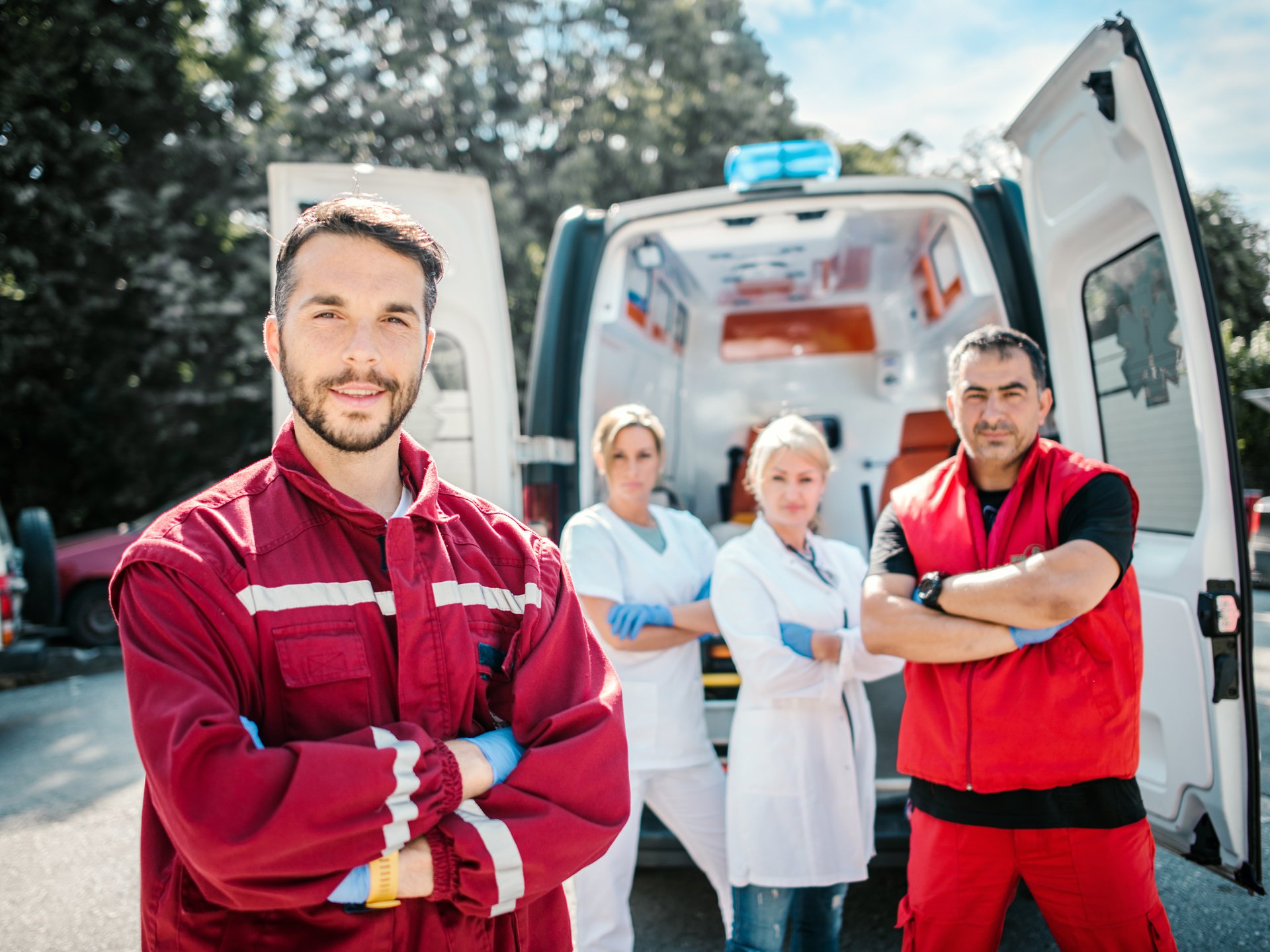 Emergency doctor and paramedic with ambulance